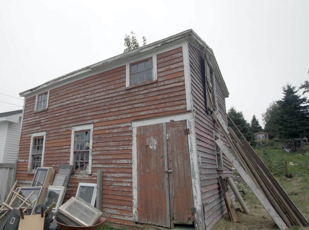 before short of old run-down red barn