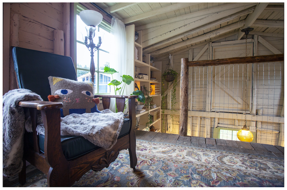 top of rustic loft space with handmade wood railing