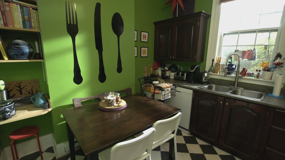 before of green kitchen with dark cabinets