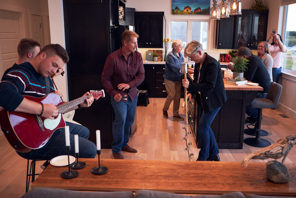 Randy, Sharon, Sharon and the team enjoy a kitchen party in the renovated kitchen