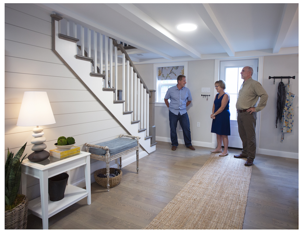 Randy, Pam and Fred in spacious open-concept home entryway