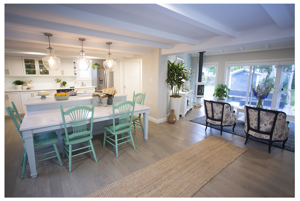 open-concept kitchen with view of double-level island and living room