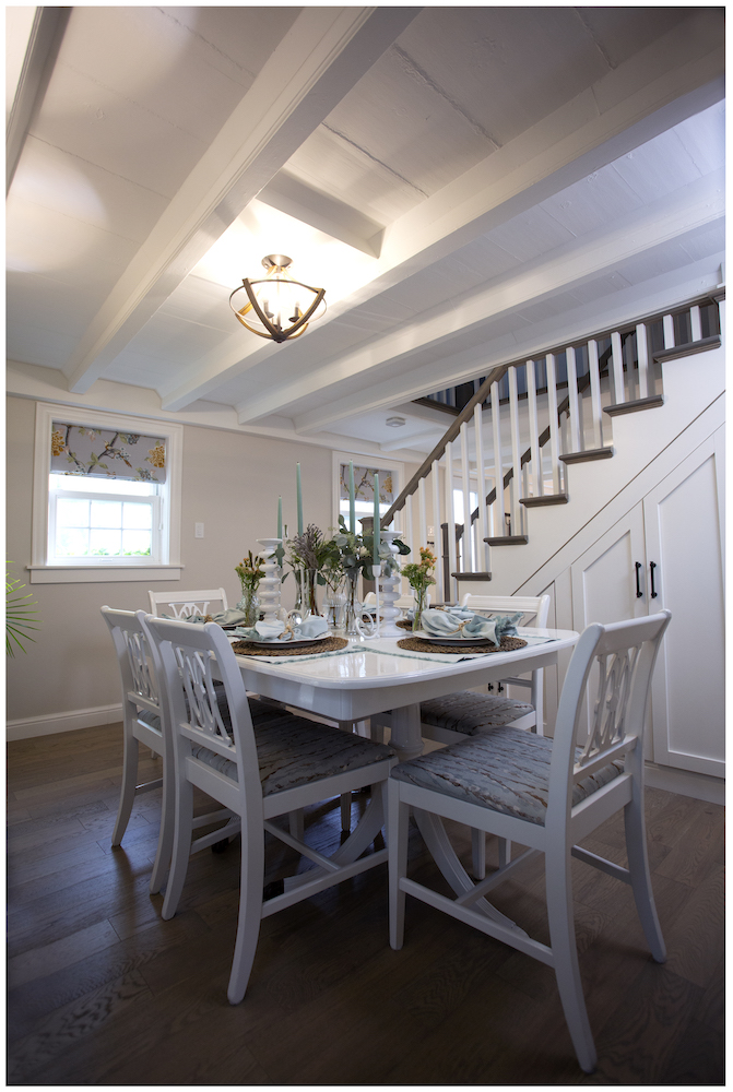 dining room with staircase and white table and chairs