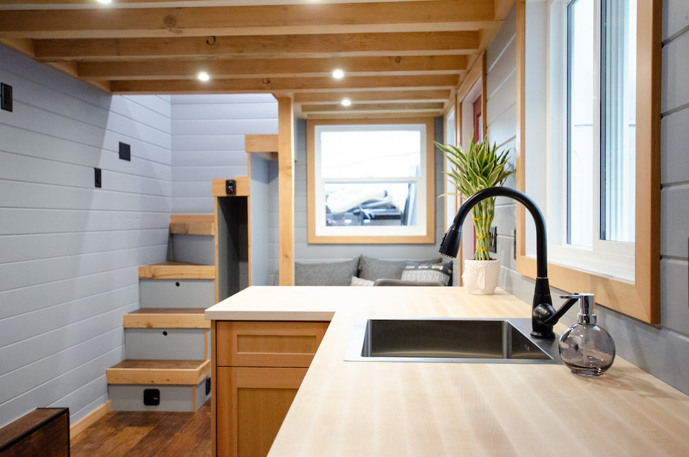 blue and wood kitchen in tiny home