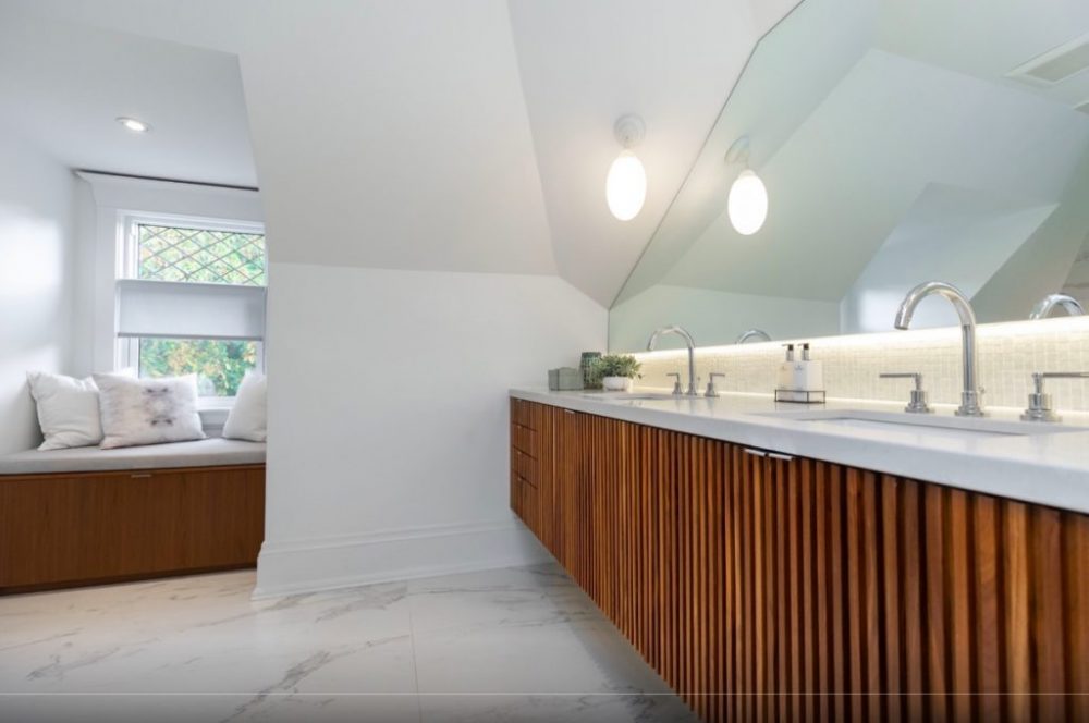 Ridged vanity in contemporary bathroom with canted ceiling