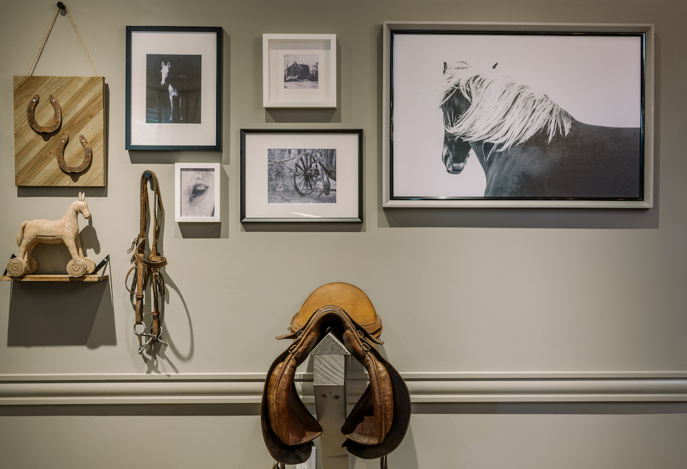 horse themed grey feature wall with vintage saddle