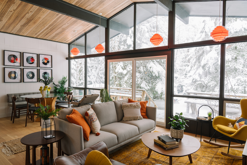 white living and dining space with floor-to-ceiling windows