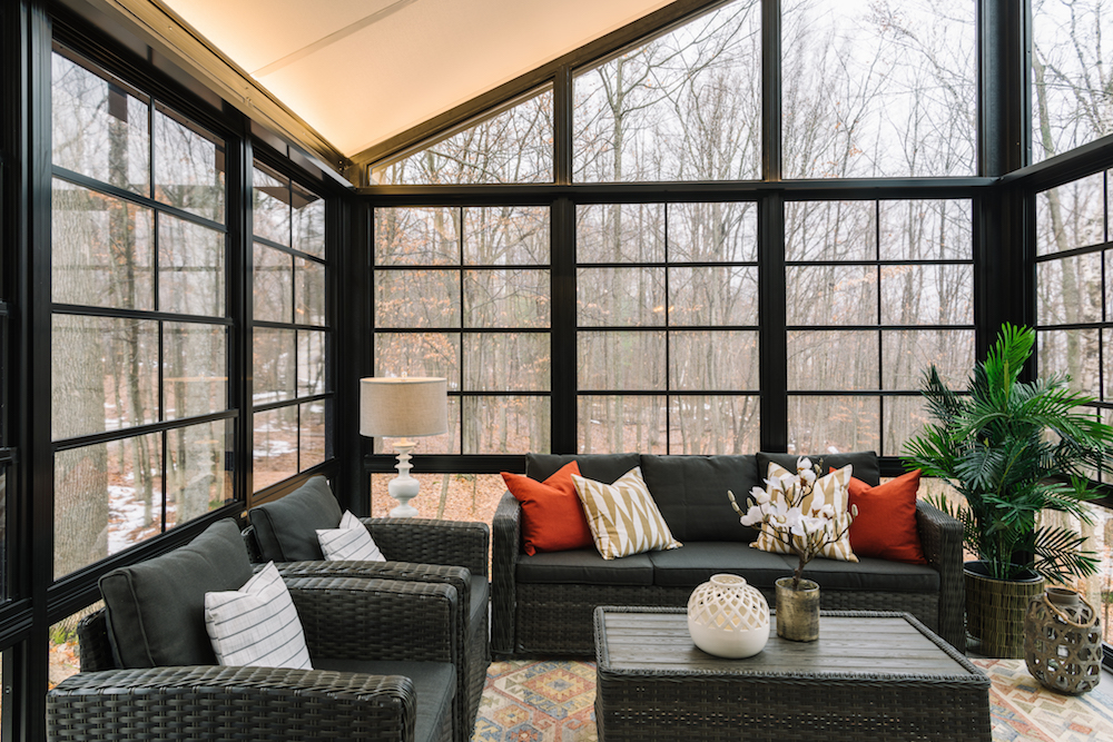 interior of sunroom with luxe black wicker furniture