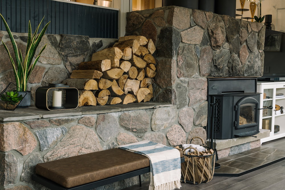 stone fireplace with pre-cut wood