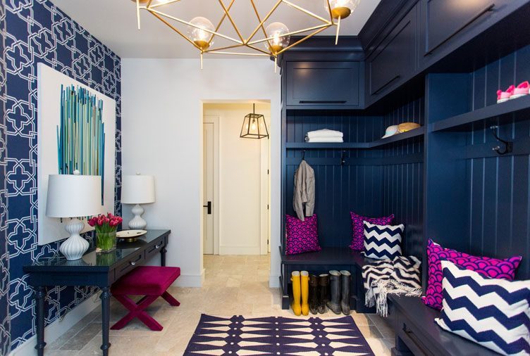 A spacious deep navy blue mudroom with jewel-tone decor