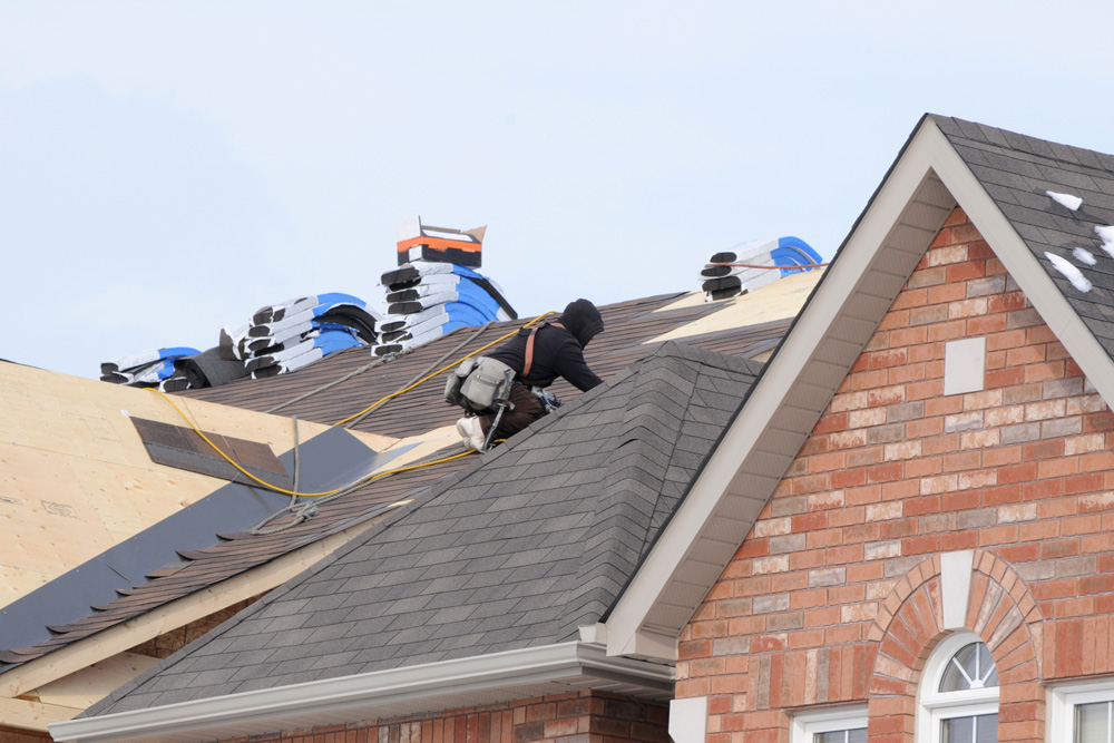 Workers installing a new roof