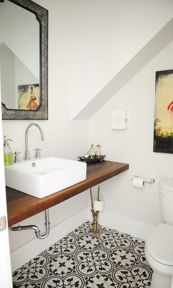 Black and white bathroom tile under vessel sink