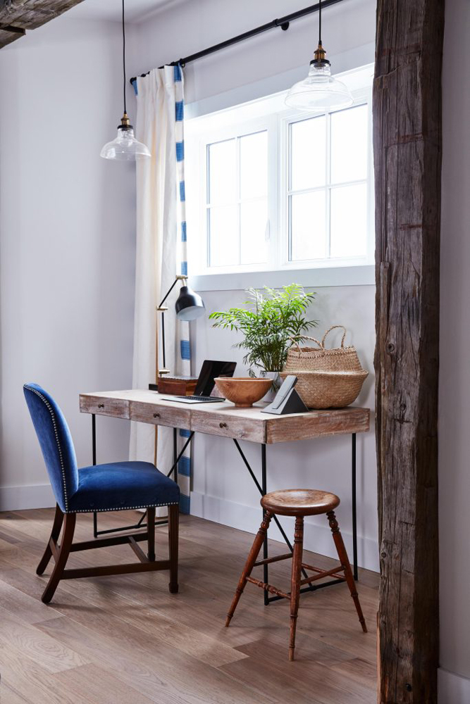 Hallway desk underneath window and overhead lighting