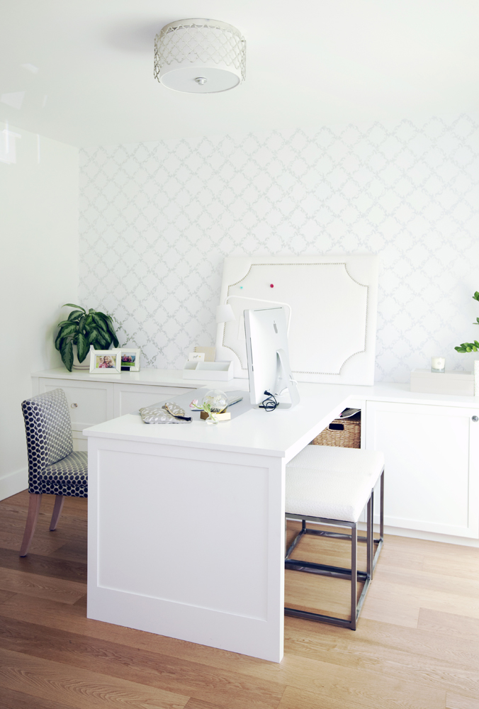 Minimalist white desk with graphic print chair