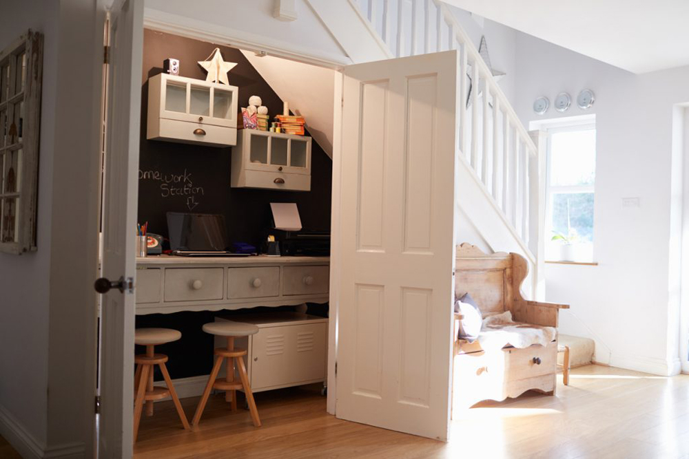 Office under the stairs, with door