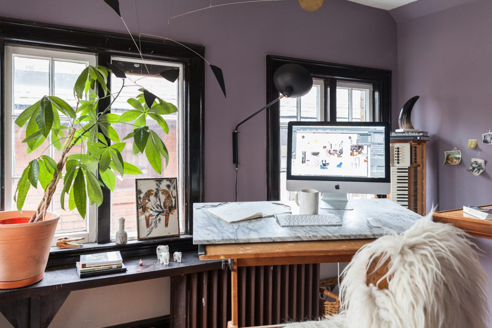 Home office on drafting desk in sunroom