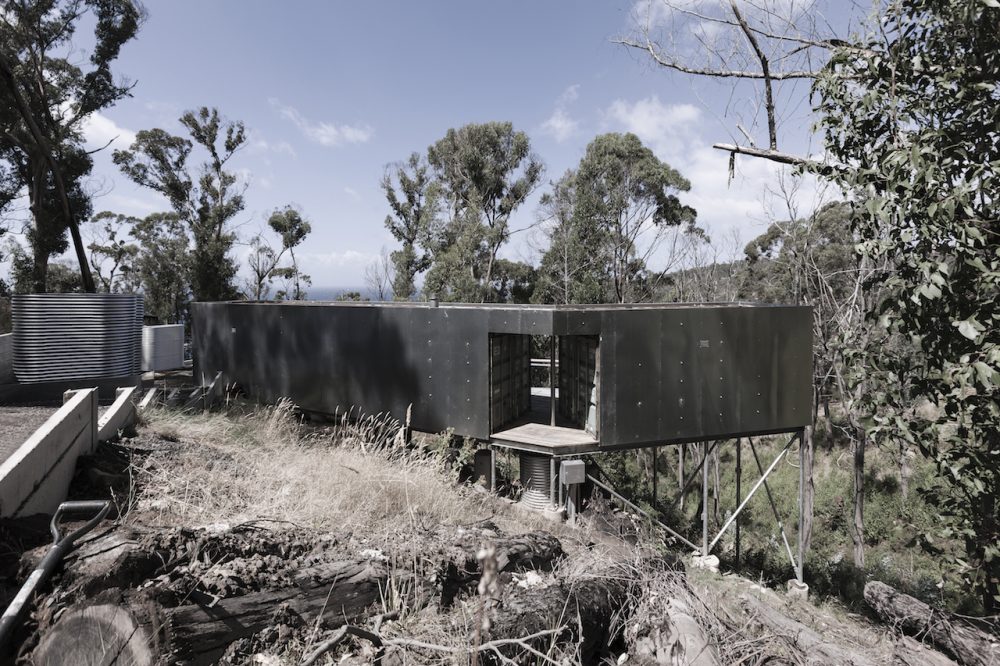 A hillside container home, constructed from three 20-foot shipping containers