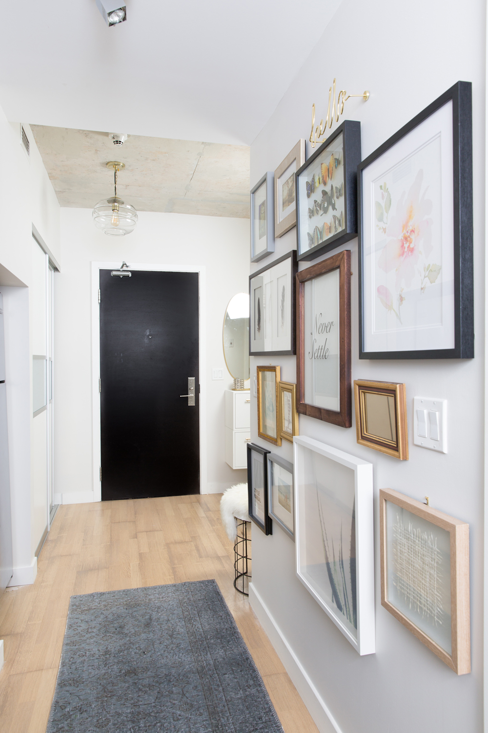 Gallery wall in a condo hallway