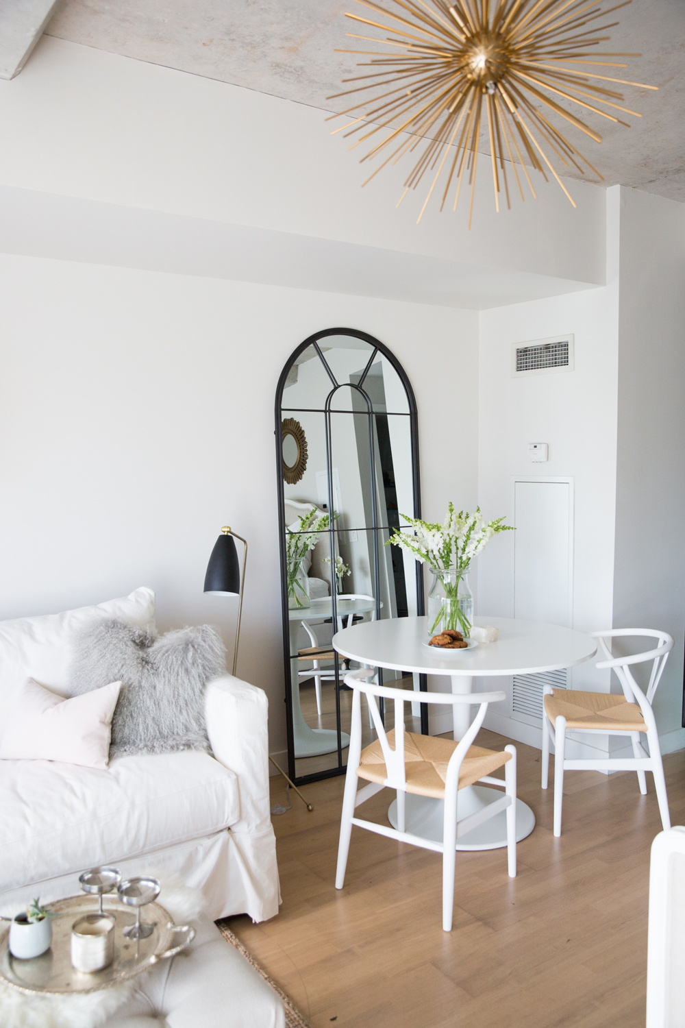 Dining area in white studio apartment