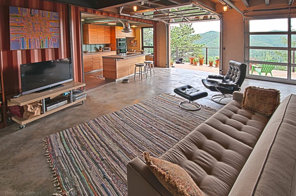 Spacious interior of container home with view of the mountains