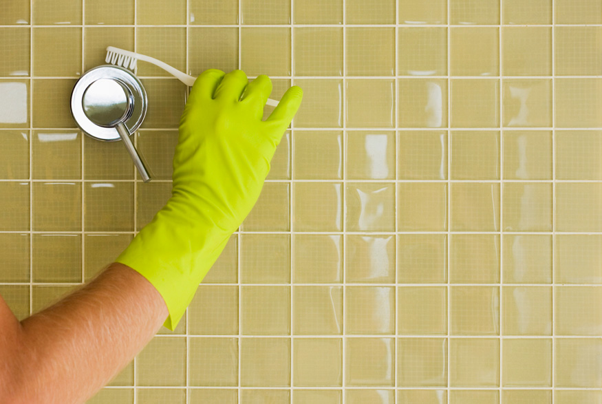 Cleaning grout with a toothbrush