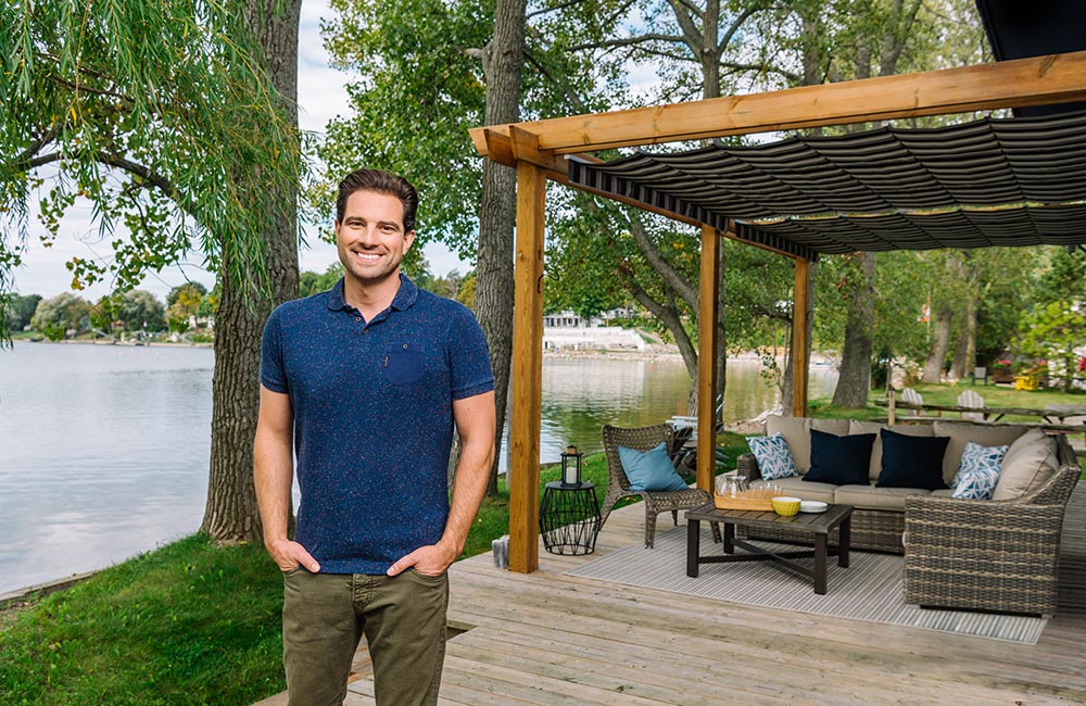 Scott McGillivray in front of lakefront property