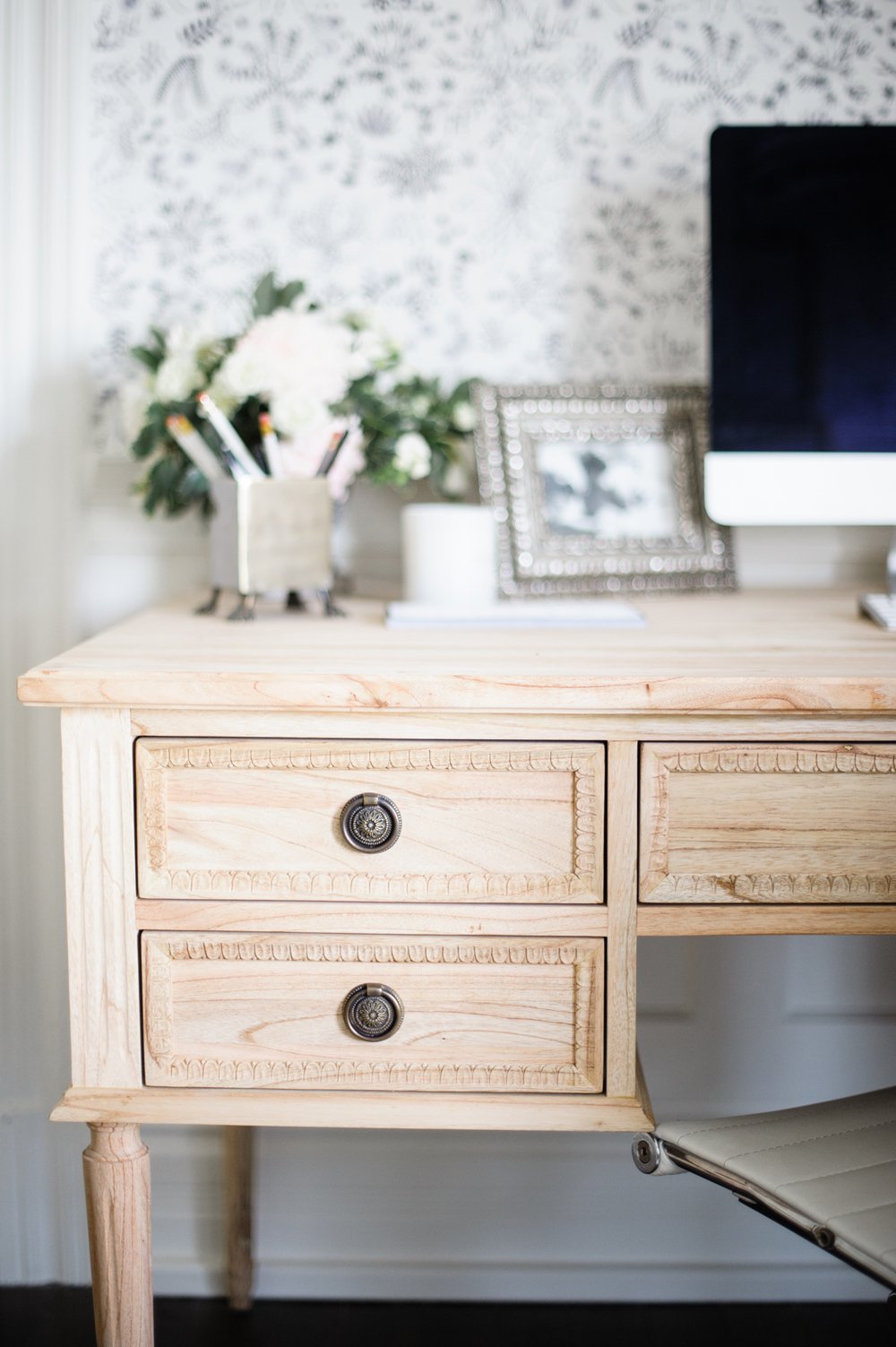 Raw wood desk with circle pulls