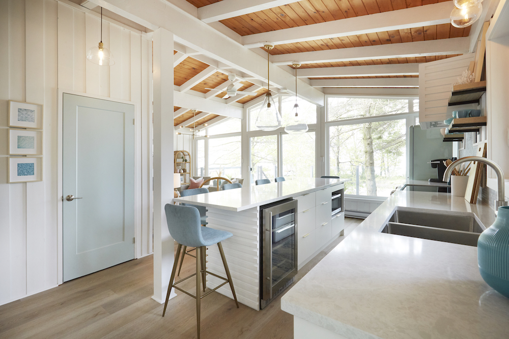 Coastal kitchen with white walls and island