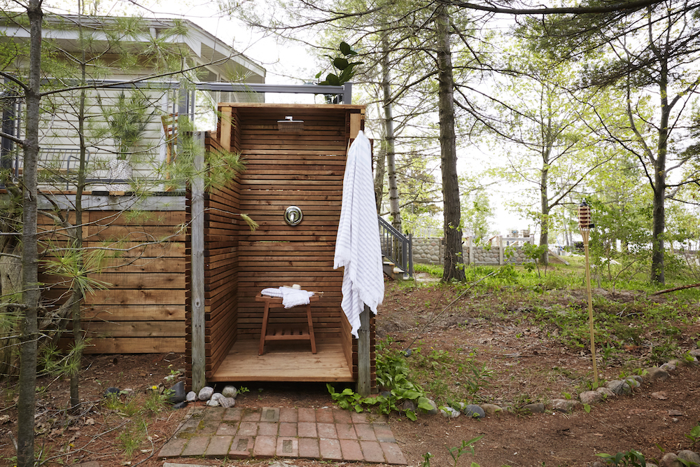 Outdoor wooden shower near beach