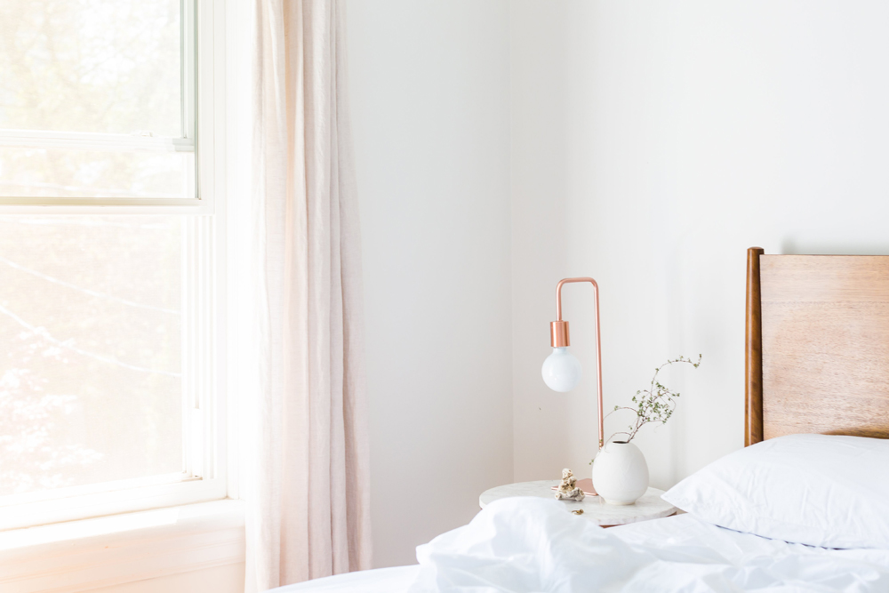 bright bedroom with lots of light coming through the window