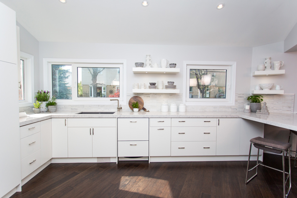 Modern white kitchen with open shelving.