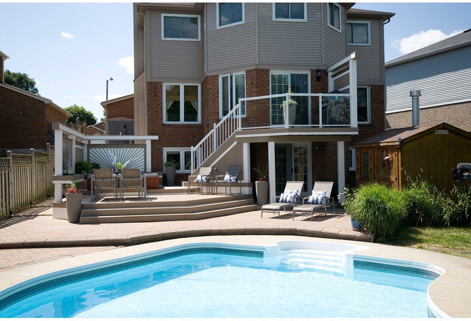 A deck overlooking an outdoor pool