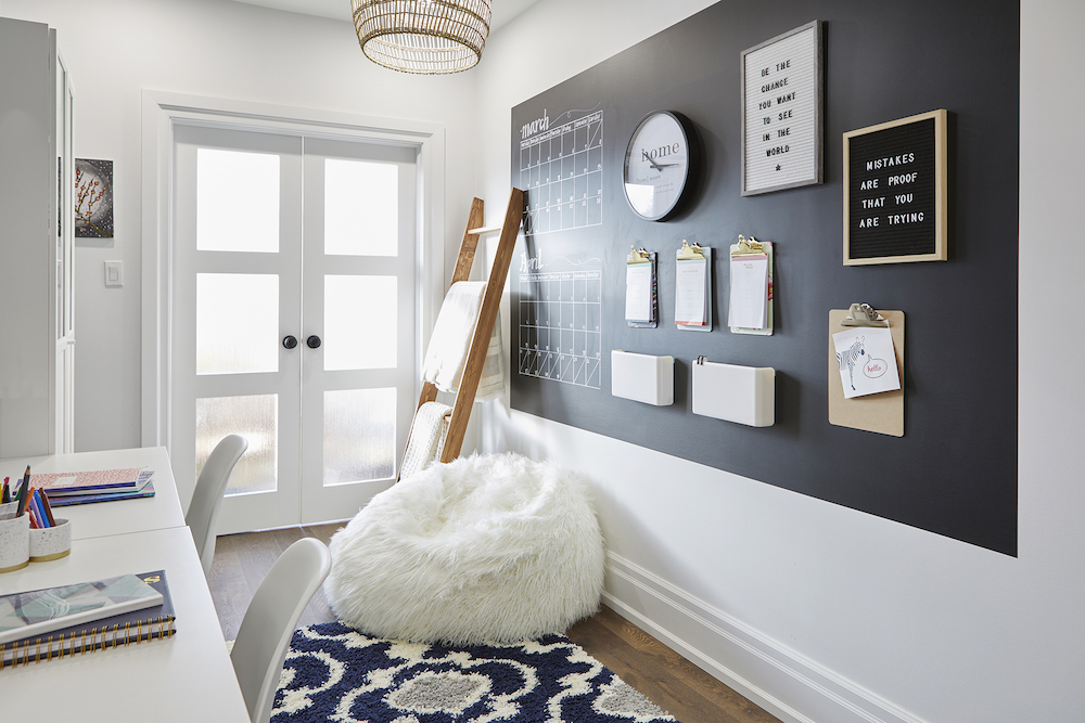 bright workspace with blanket ladder, plush white bean bag chair and organizers on wall