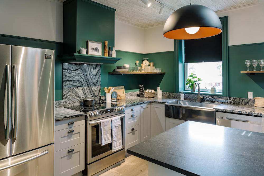 carriage house kitchen with dark green walls