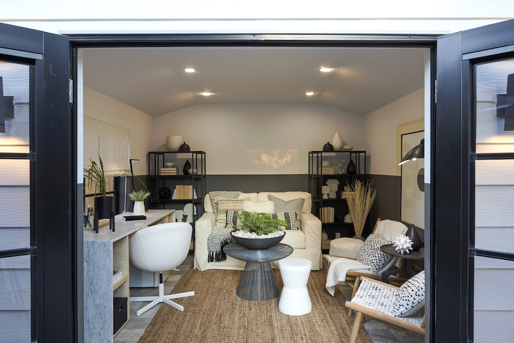 interior of garage living space with dark colour on lower half of walls