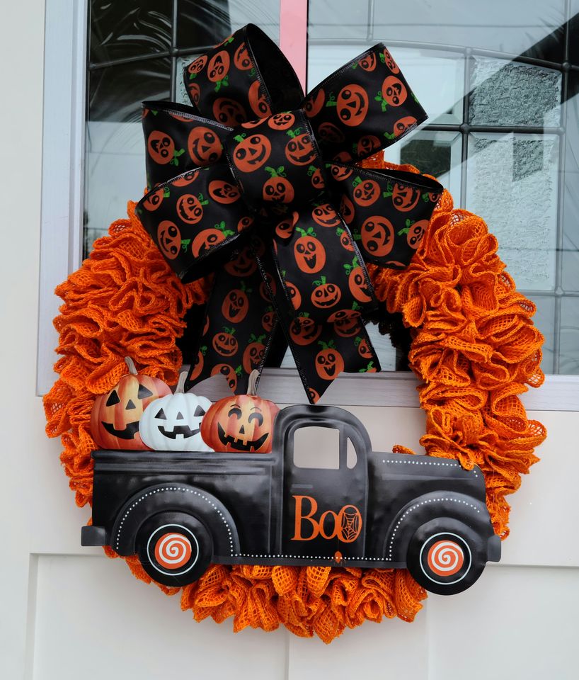 An adorable orange and black Halloween wreath