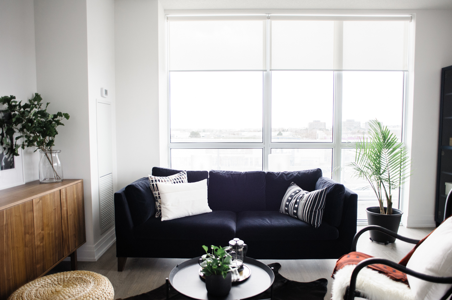 Black sofa with decorative pillows