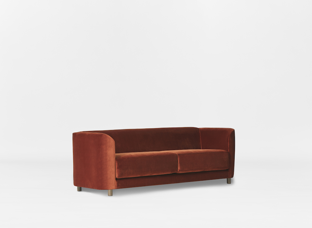 Burnt-orange velvet sofa