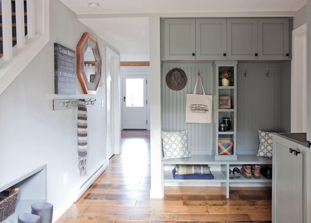 Blue/grey mudroom with hardwood floor