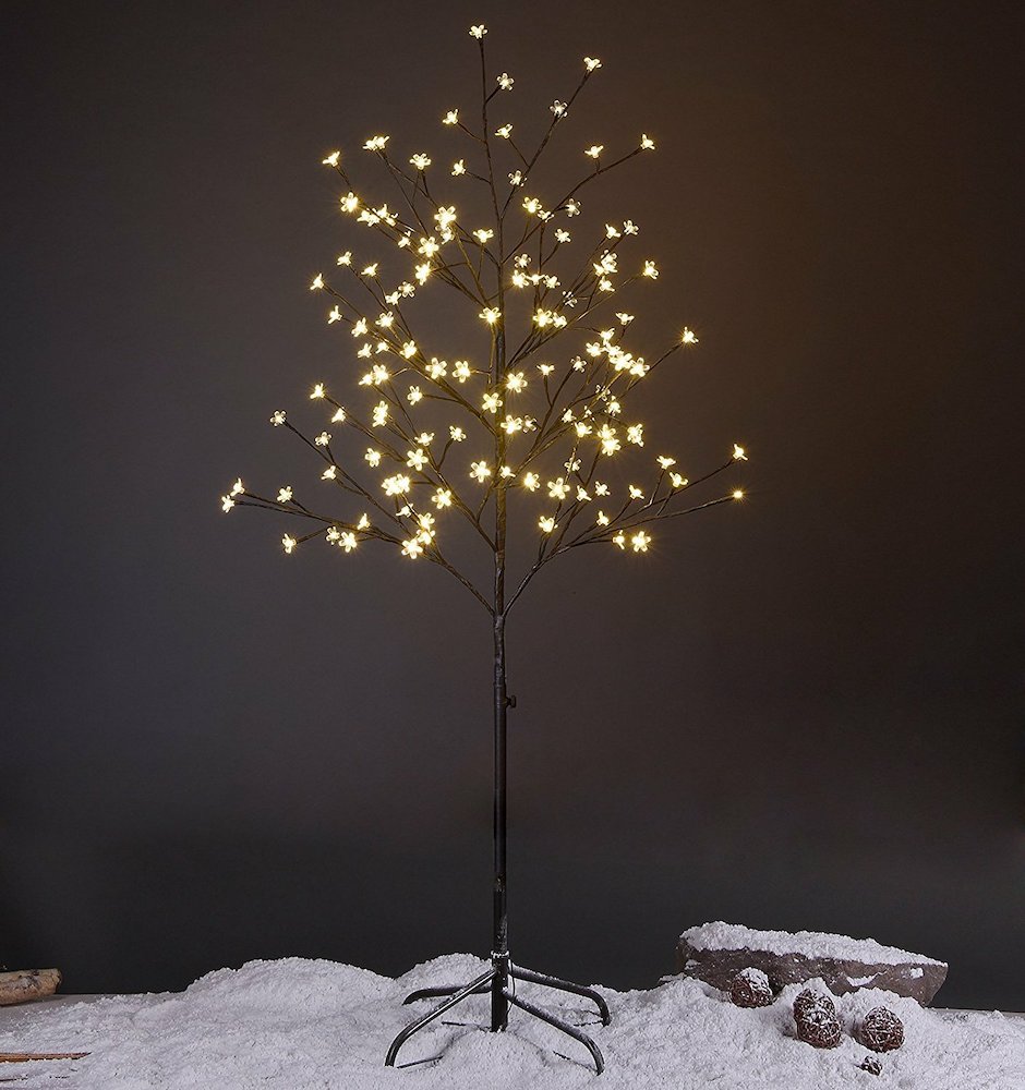 faux outdoor tree with small white lights