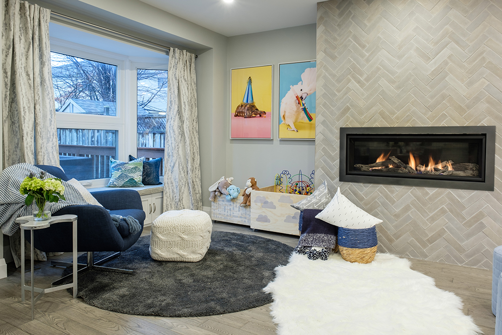 cozy grey living room with fireplace and colourful wall art