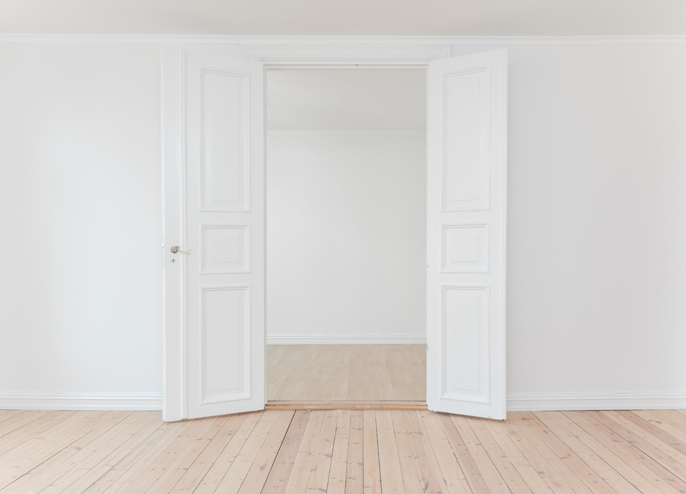 All-White Painted Room With Light Oak Floors