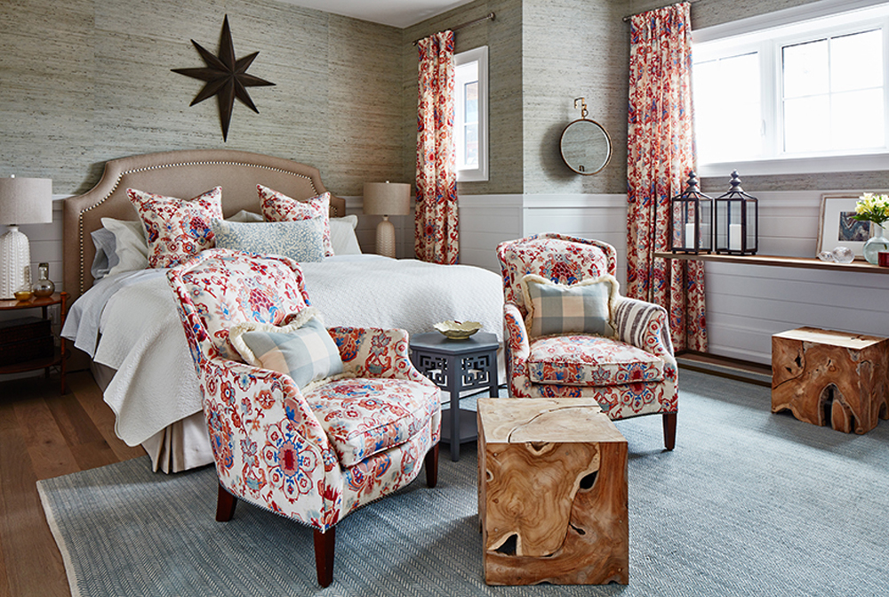 Rustic pink bedroom with wallpapered walls and wood decor