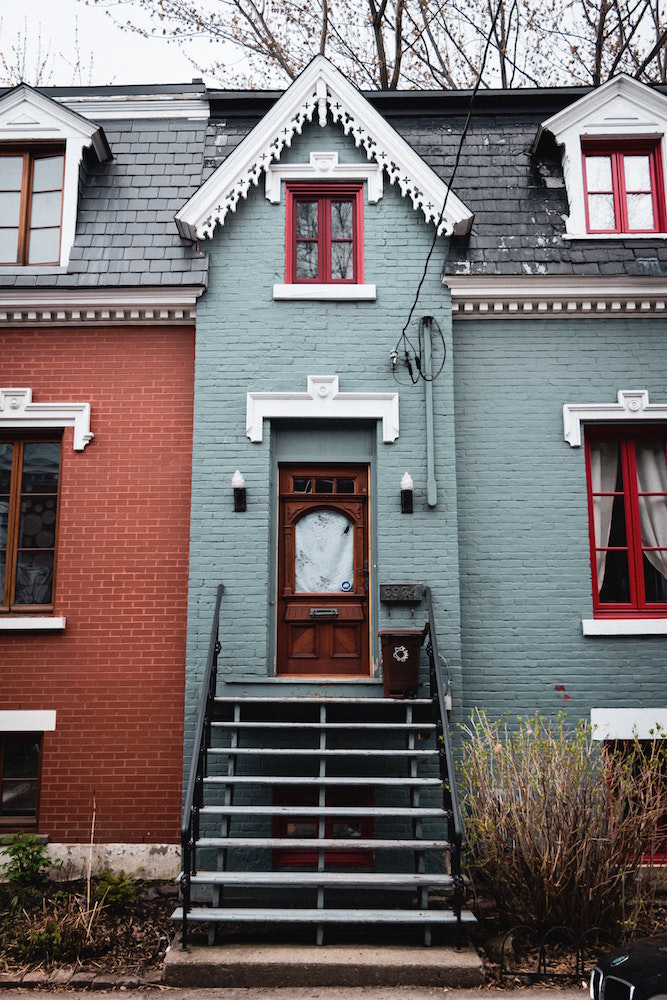 attached blue and red houses with grey roof