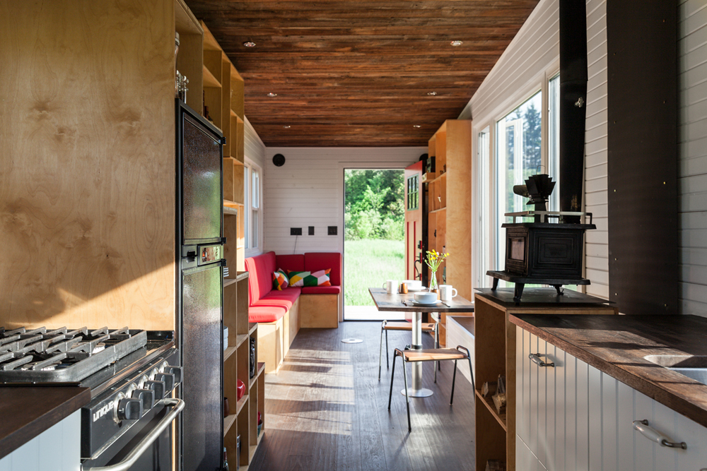 A small, narrow kitchen in a camper with plenty of storage space