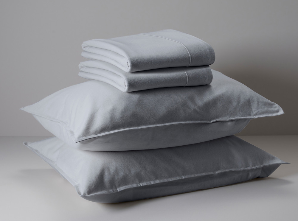 stack of two pillows and two sheets