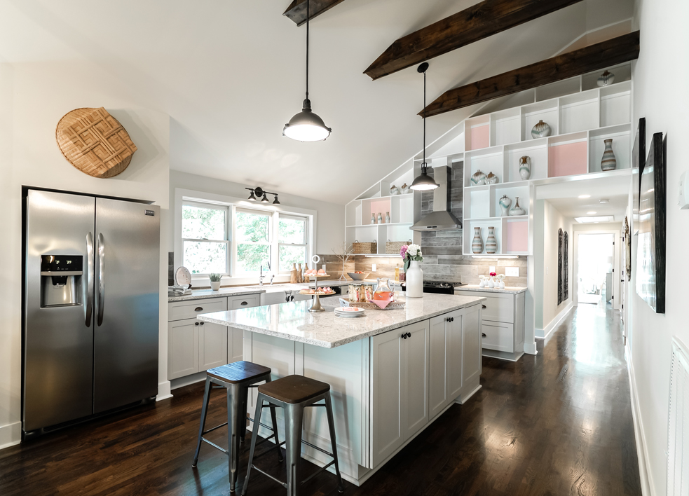 Pretty white kitchen with pops of pink.