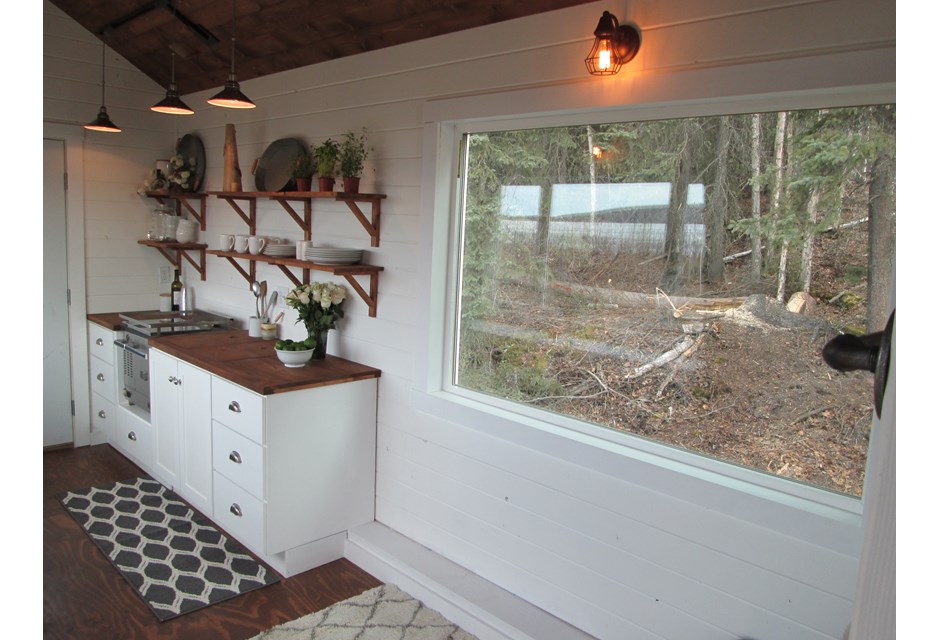 kitchen with pendant lights an open shelving in white tiny house