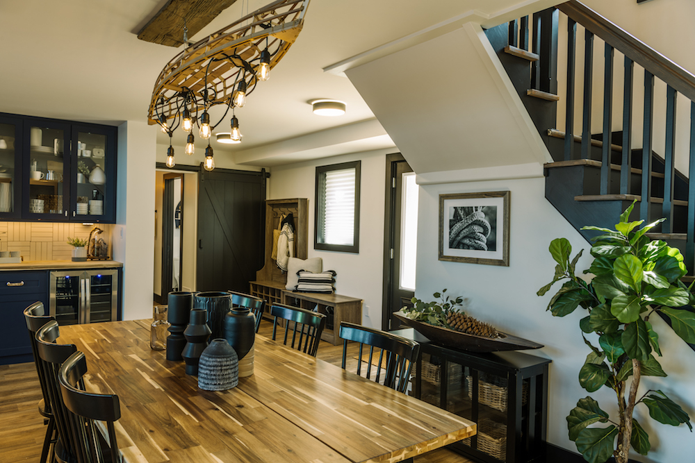 Dining room with large wood table and canoe light fixture