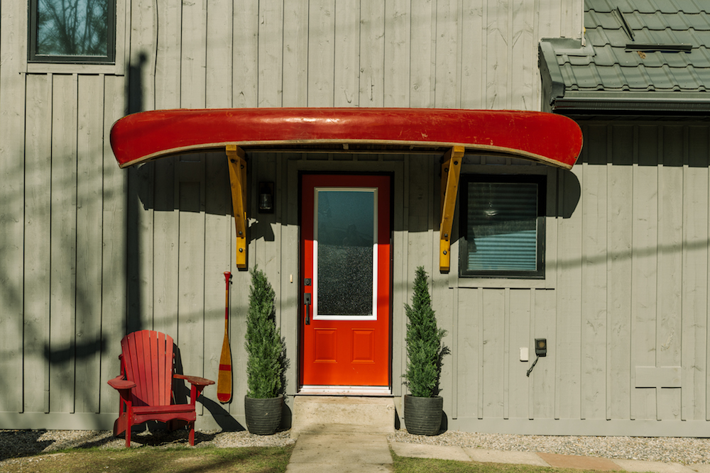 Cottage entrance with canoe portico